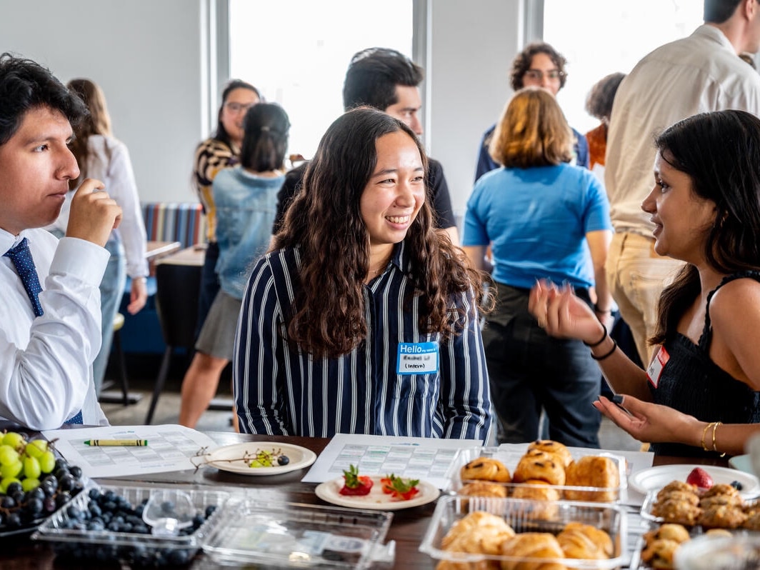EDF employees and interns lunching together in the kitchen.
